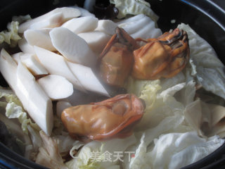 金蚝鲜味砂锅煲的做法步骤：10